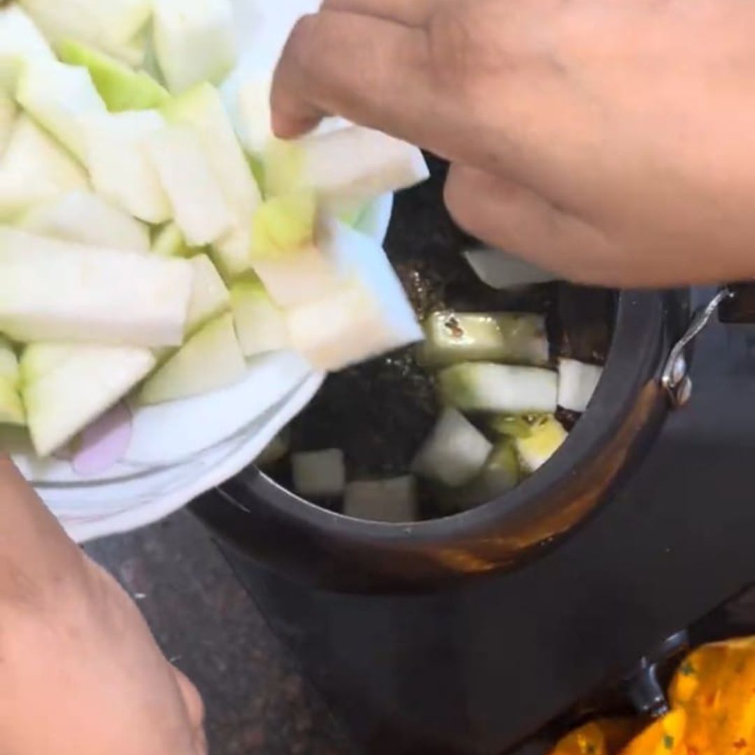 Image of Add grated or cubed lauki and sauté for 2-3 minutes.