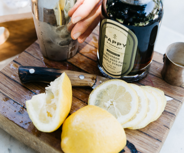 Image of Add lemon wedge, and cinnamon stick and 1 star anise...