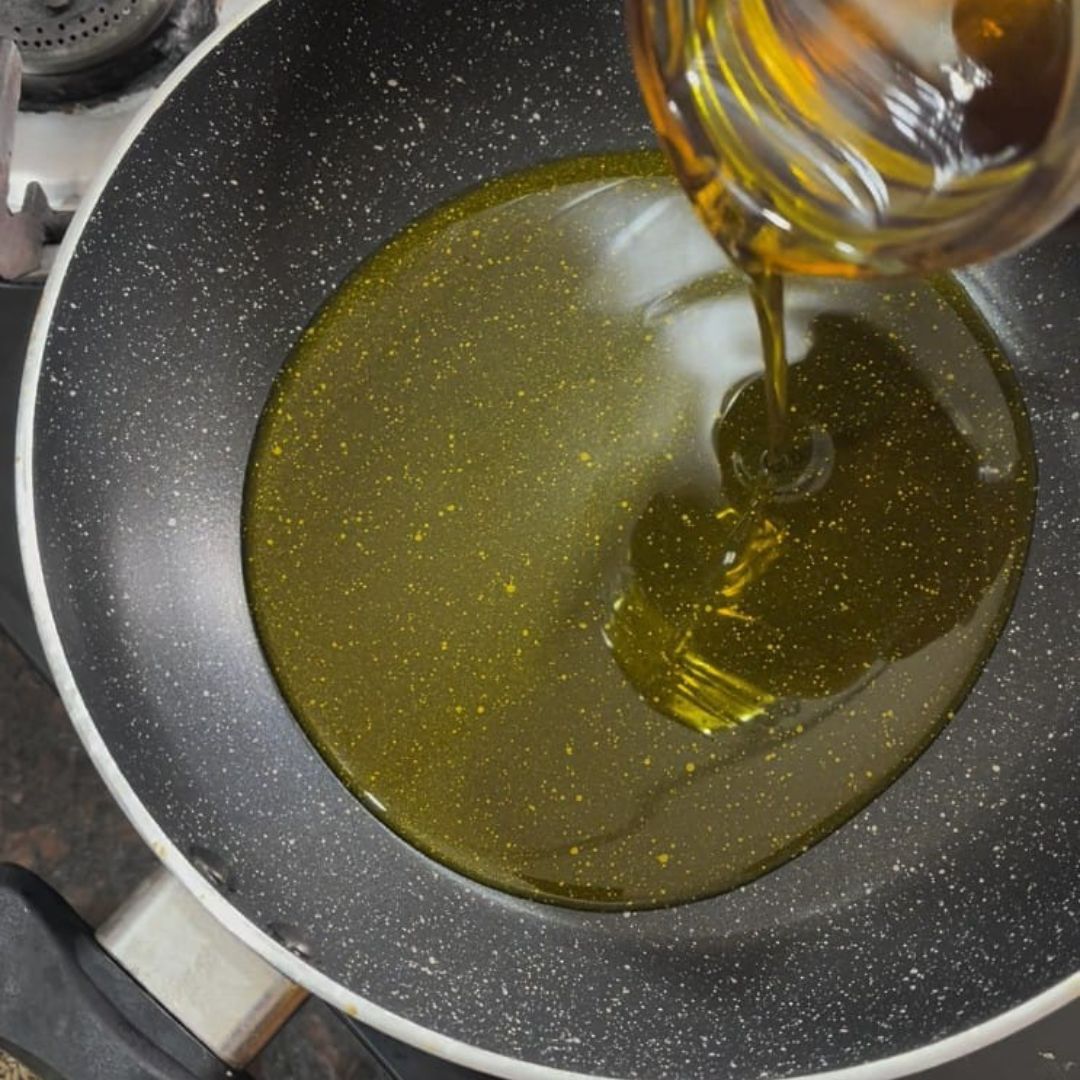 Image of Heat mustard oil in a deep pan or kadhai until...