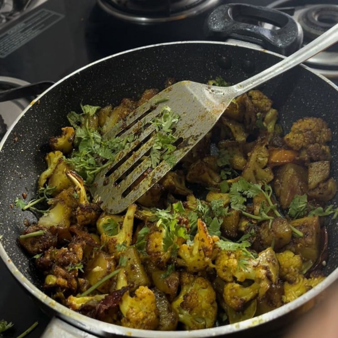 Image of Garnish with freshly chopped coriander leaves.