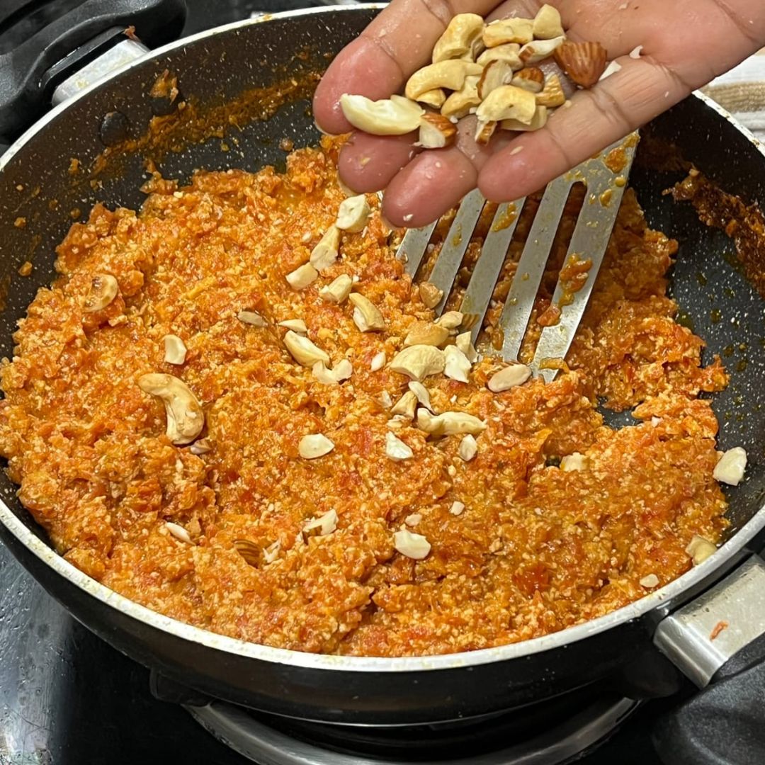 Image of Add the roasted dry fruits to the halwa and mix...