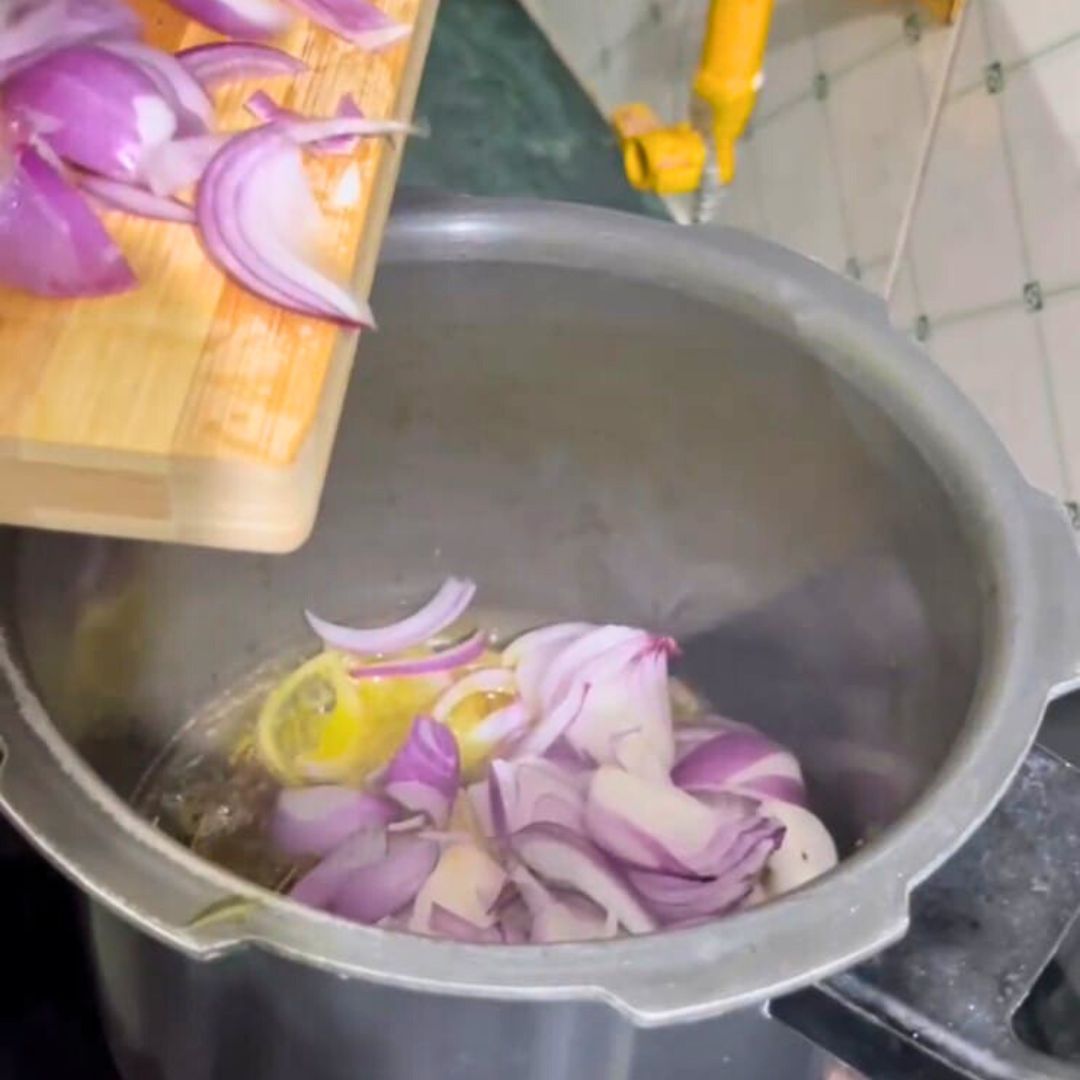 Image of Add the chopped onions and sauté until golden brown.