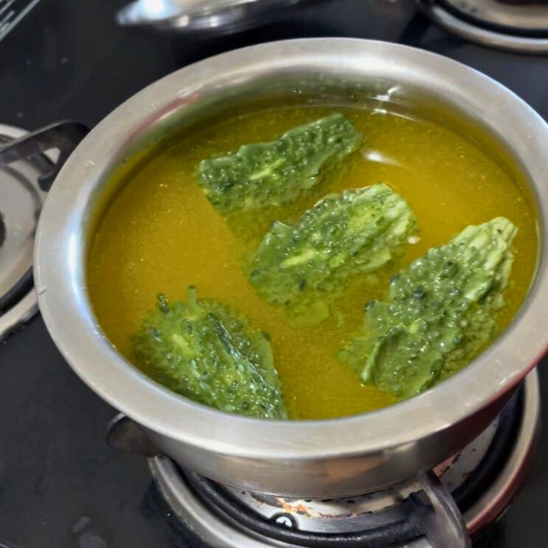 Image of In Boiling water and add turmeric powder ,salt and karela