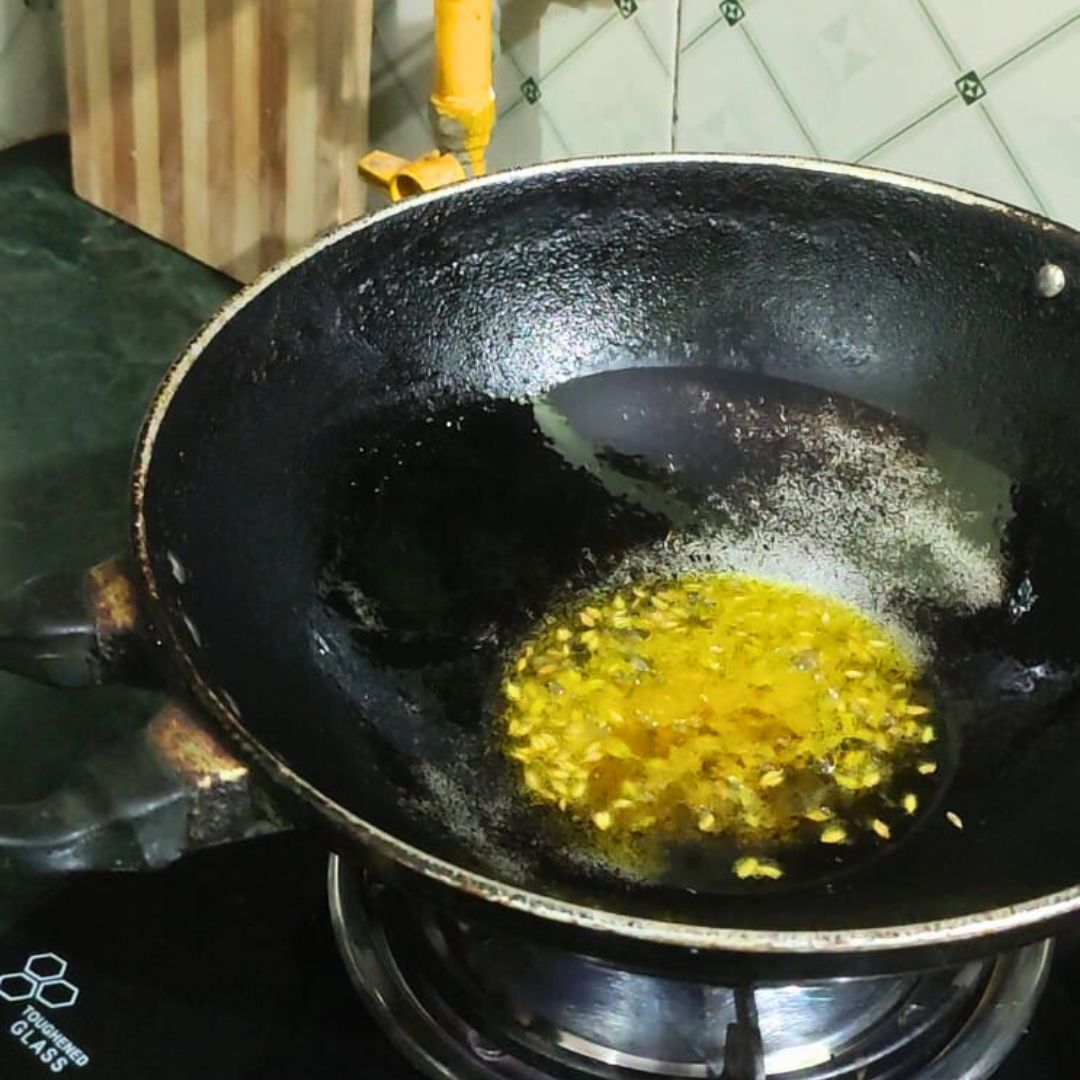 Image of Heat oil in another pan and add cumin seeds. Let...