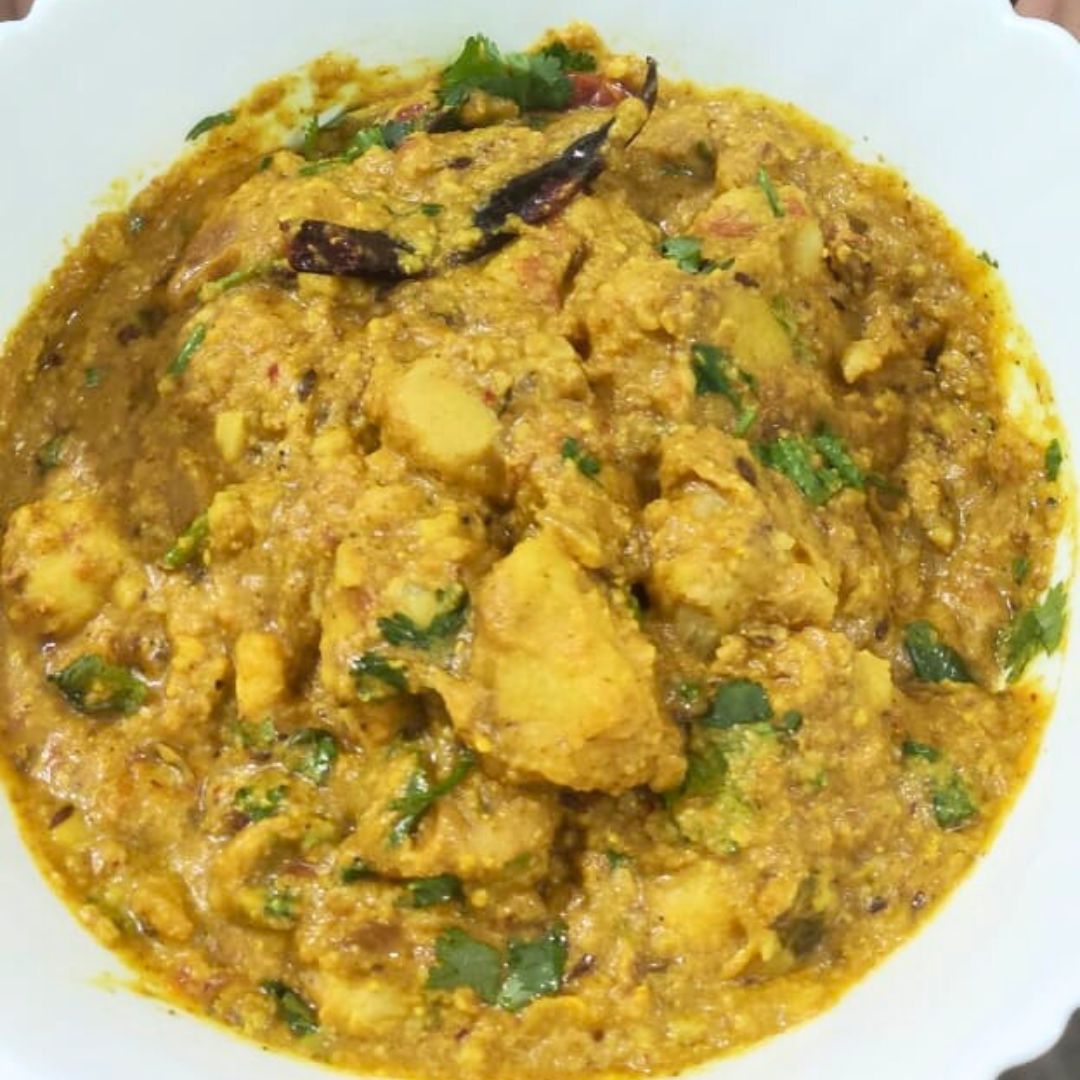 Image of Garnish the Arbi Sabzi with freshly chopped coriander leaves.