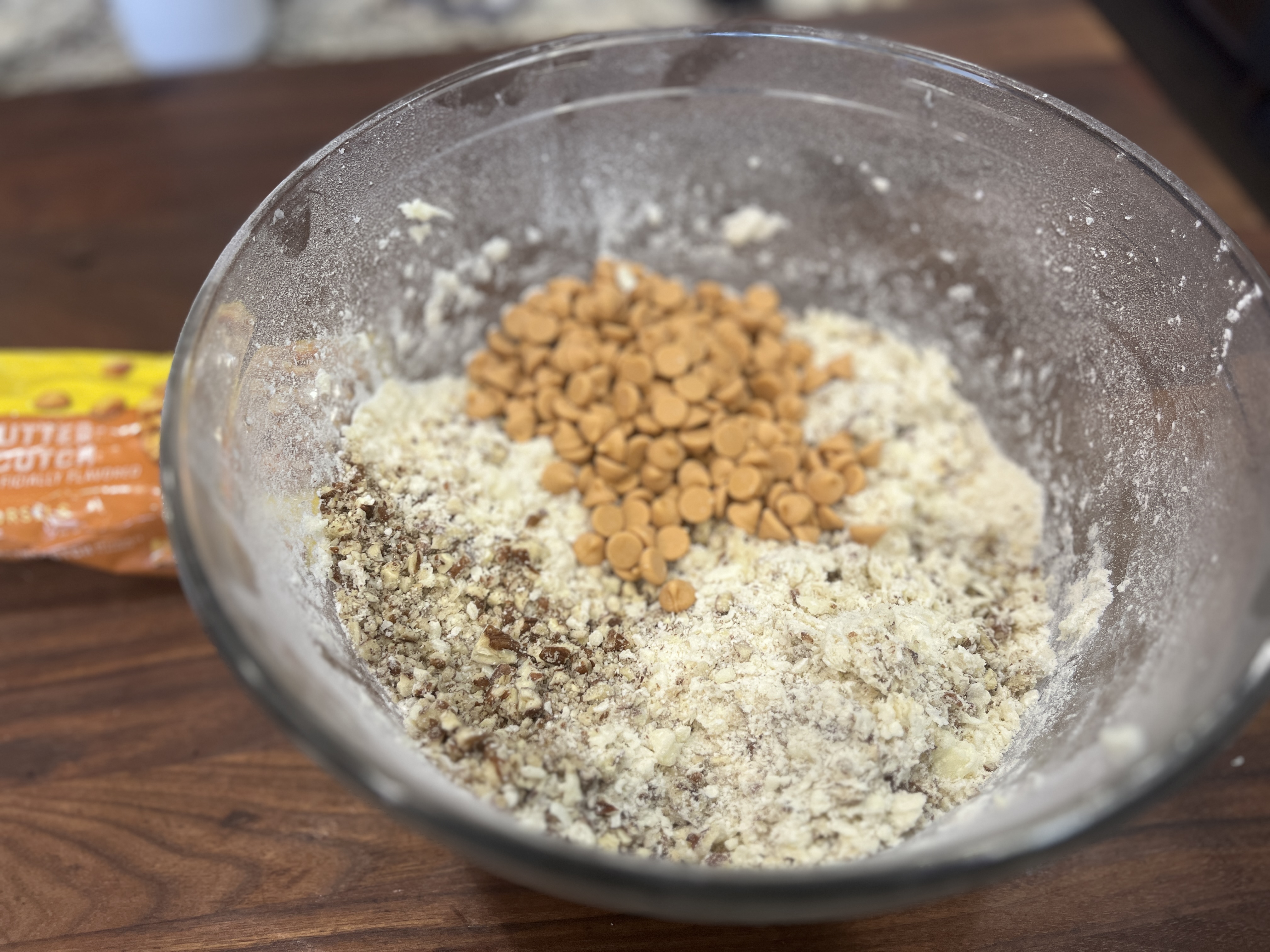 Image of Cream butter with powdered sugar. Add flour and mix well....