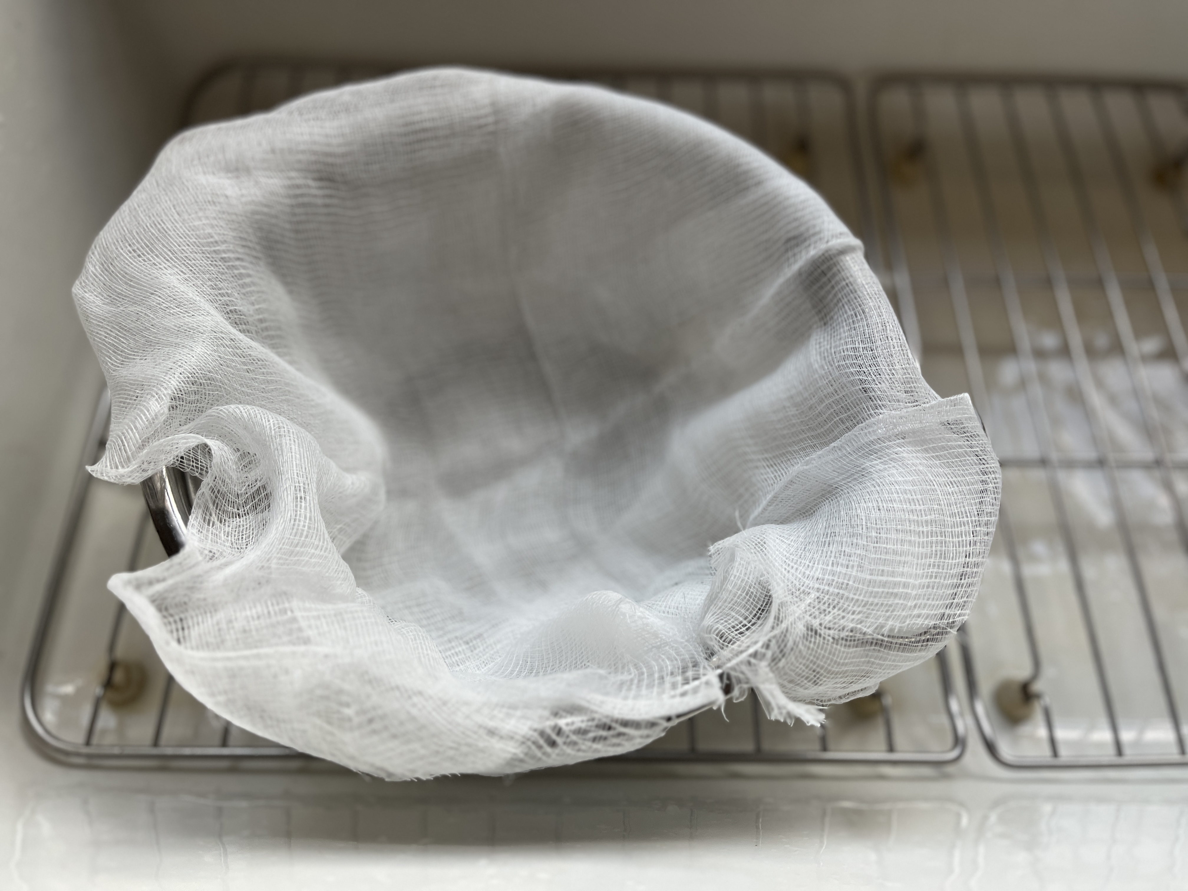 Image of Line a strainer with 2 layers of cheesecloth 