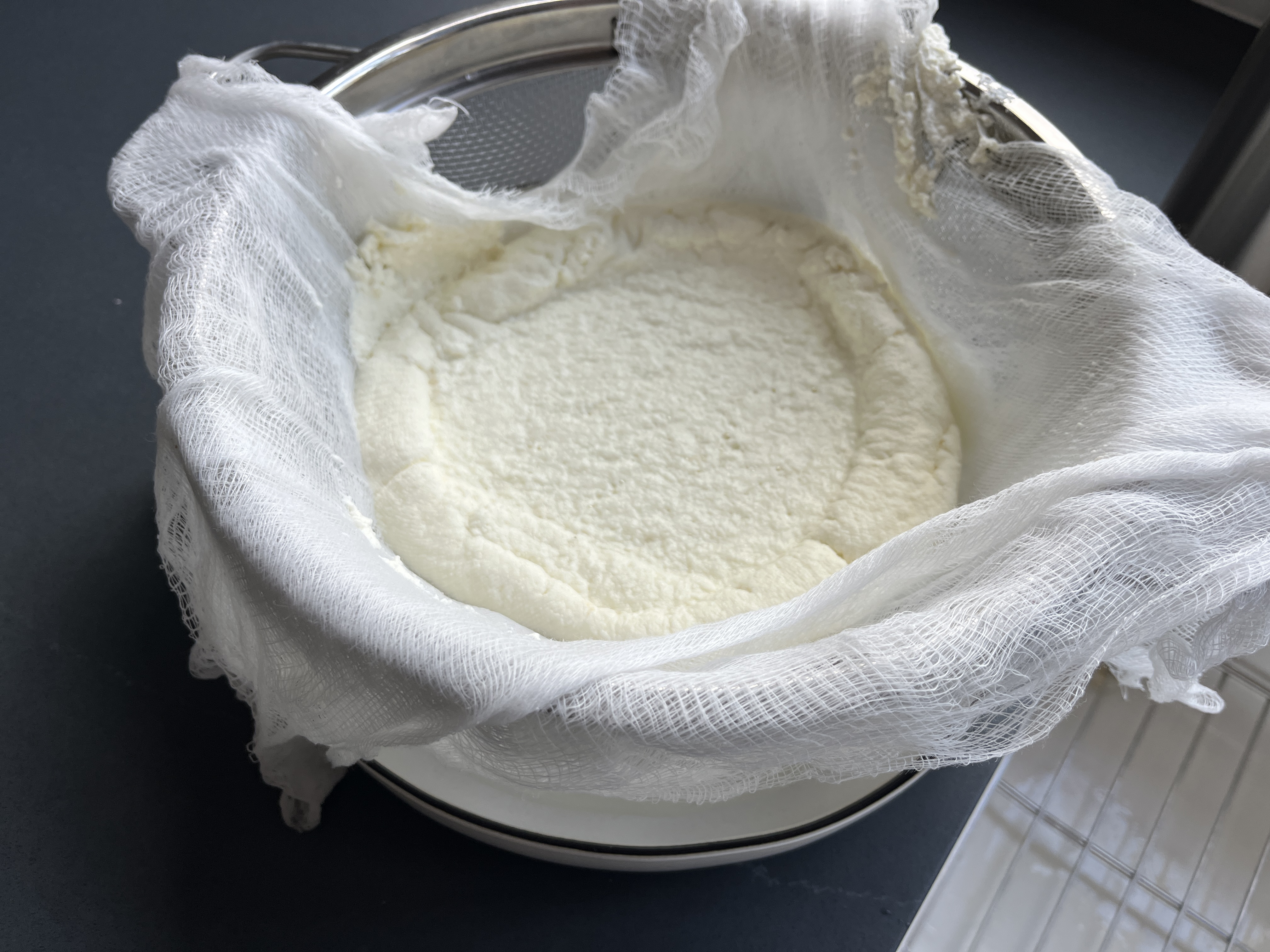 Image of Pour milk mixture into strainer. Let this sit for 1...