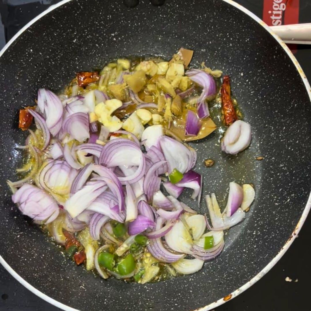 Image of Add sliced onions, crushed garlic, and ginger. Sauté until the...