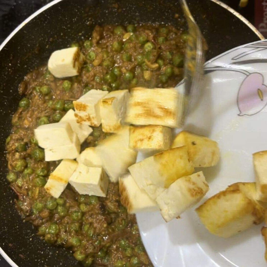 Image of Add paneer cubes and stir well so they soak in...