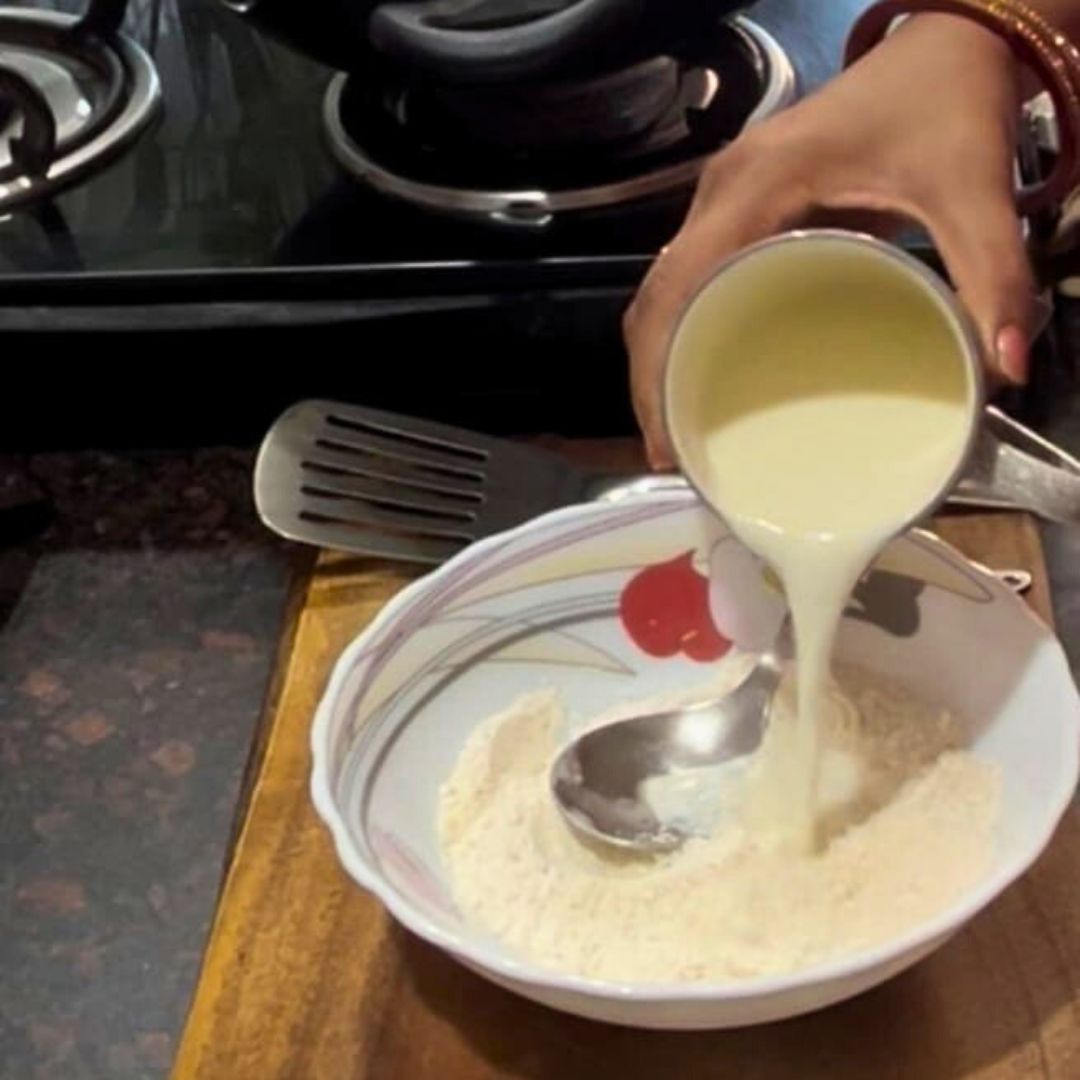 Image of Gradually add milk while whisking to form a smooth, lump-free...