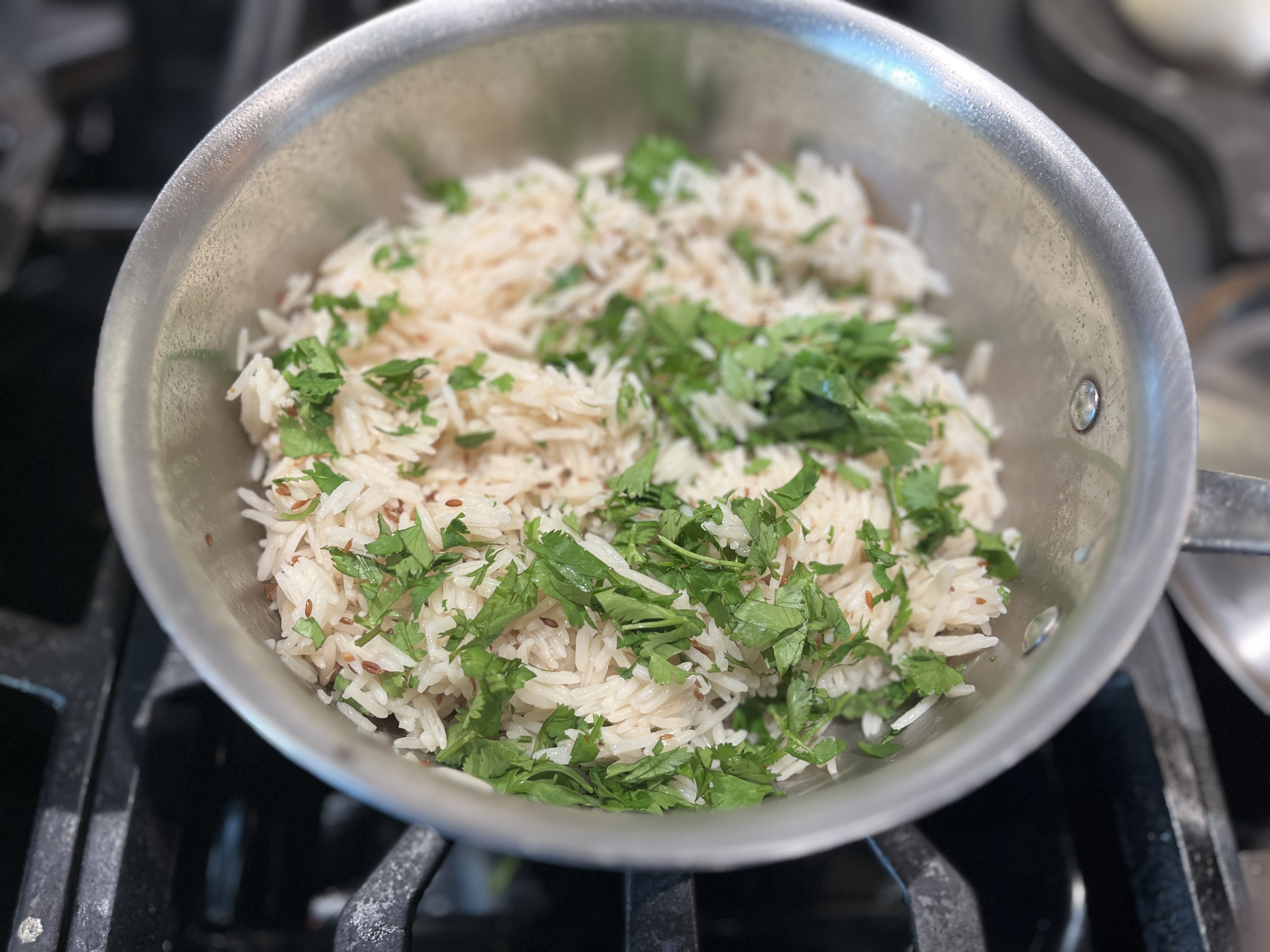 Image of Fluff and sprinkle with cilantro and serve. 