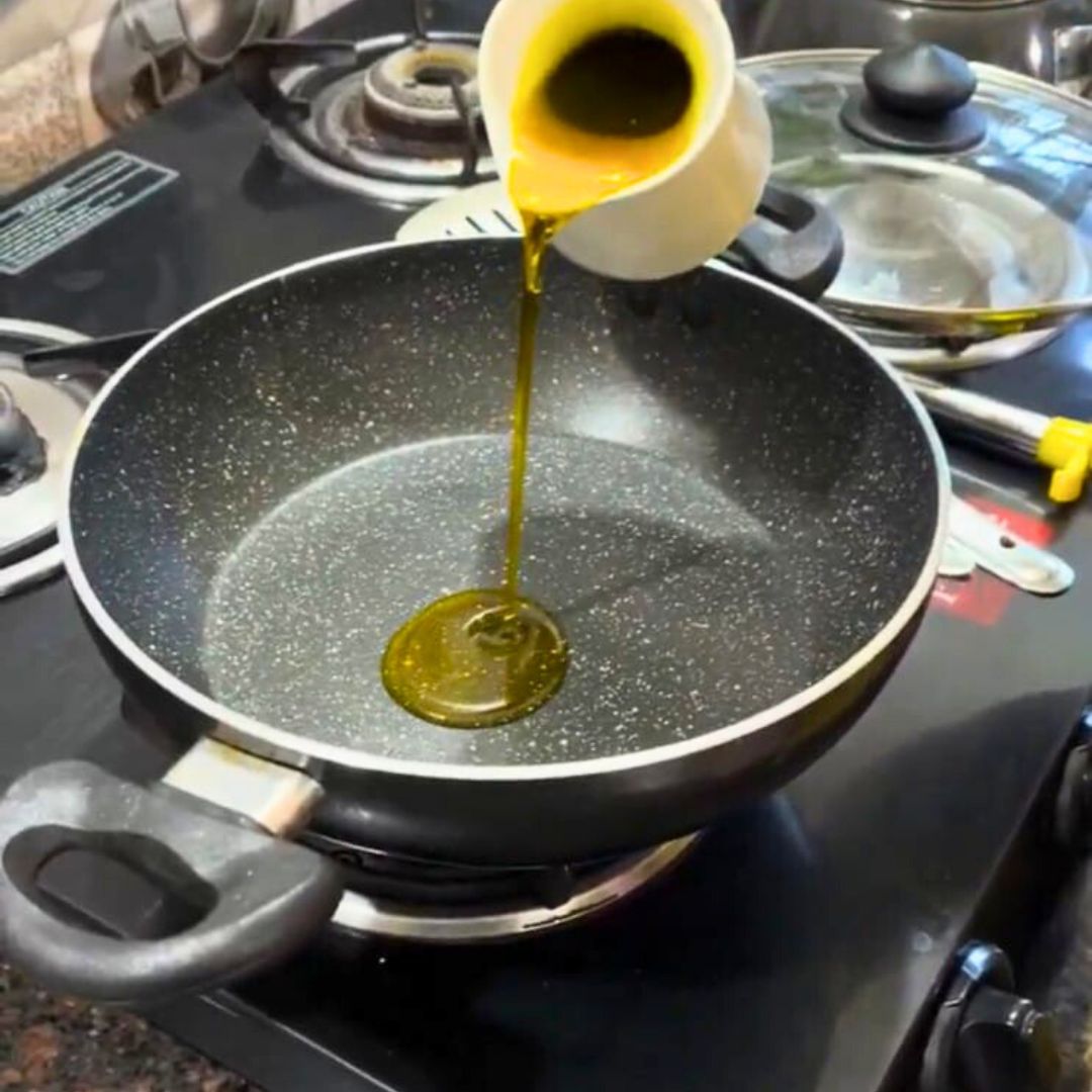 Image of Heat ghee or oil in a deep pan or pressure...