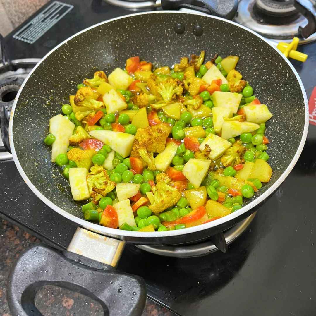 Image of Add the chopped mixed vegetables and spices.