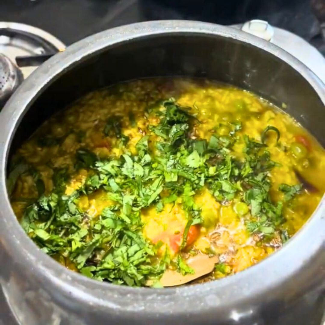 Image of Garnish the hot Veg Khichdi with freshly chopped coriander leaves.