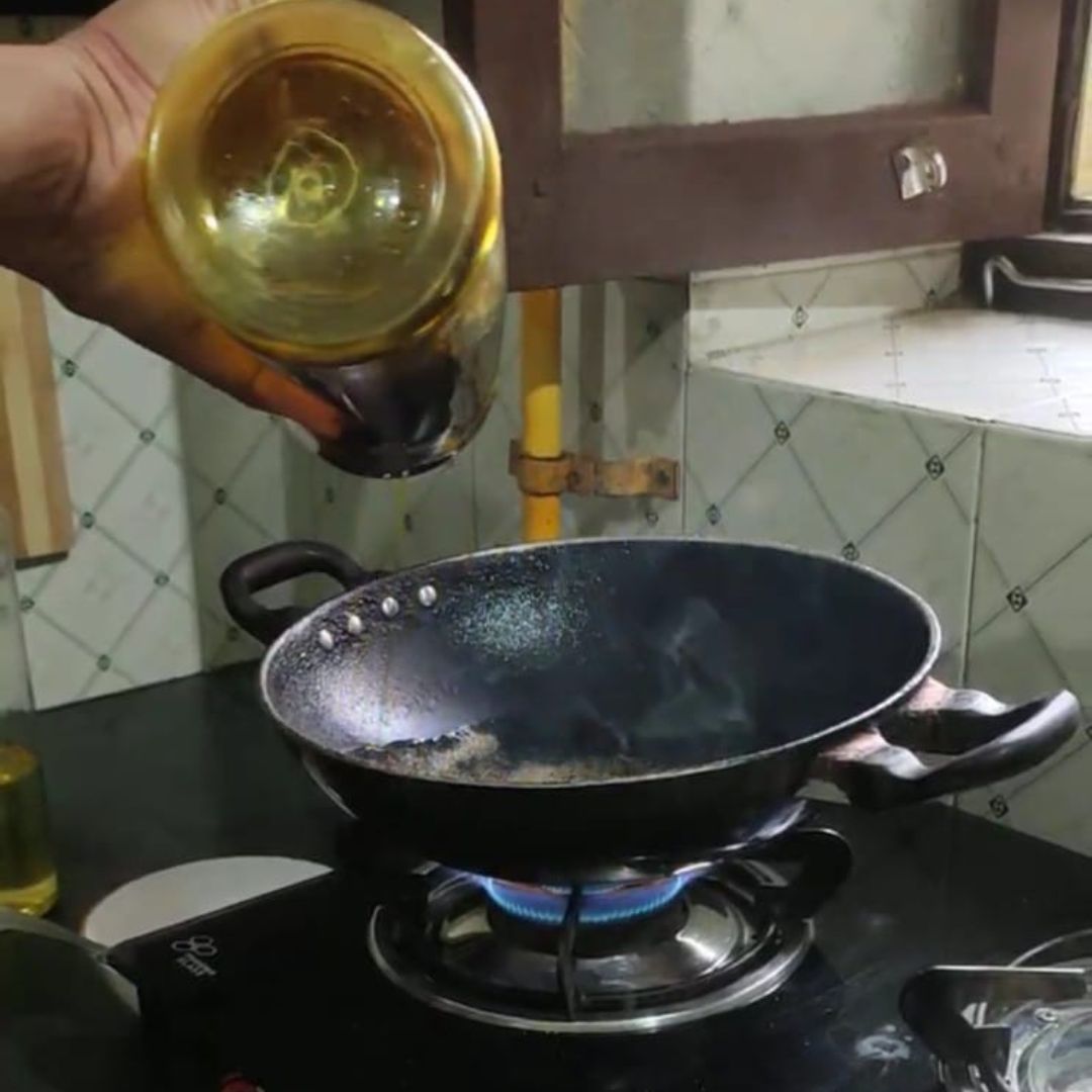 Image of Heat oil or ghee in a pan over medium heat.