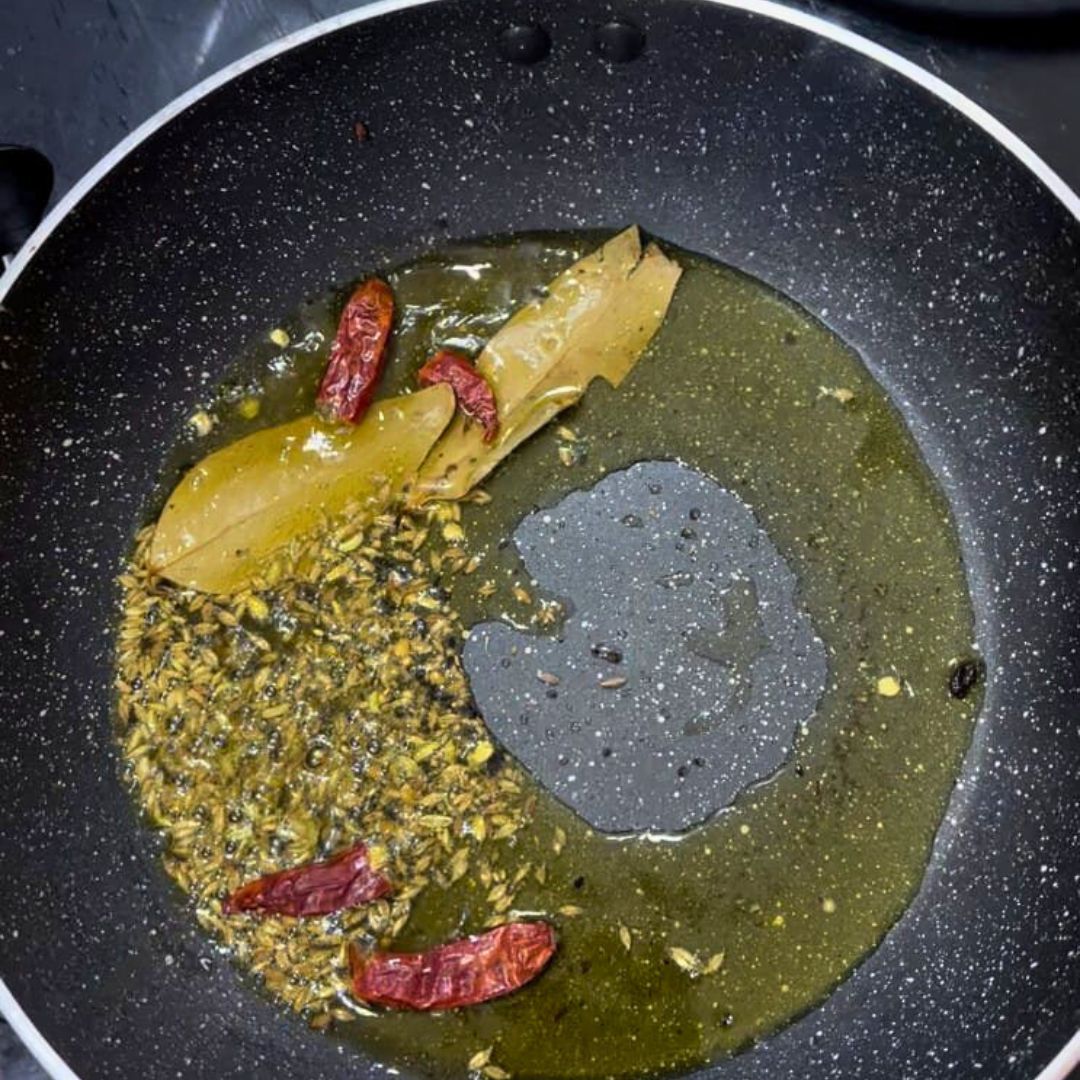 Image of Heat oil or ghee in a pan over medium heat...