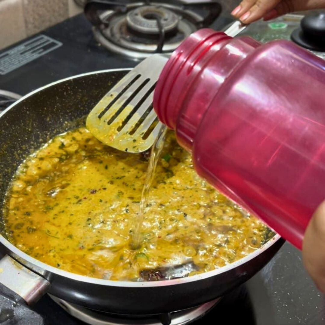 Image of Add water to adjust the consistency of the gravy. Let...