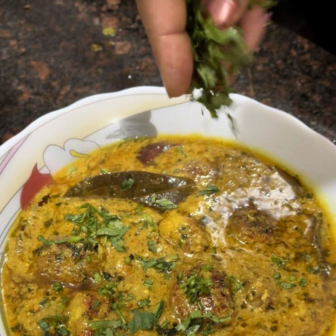 Image of Garnish the Paneer Kofta with freshly chopped coriander leaves.