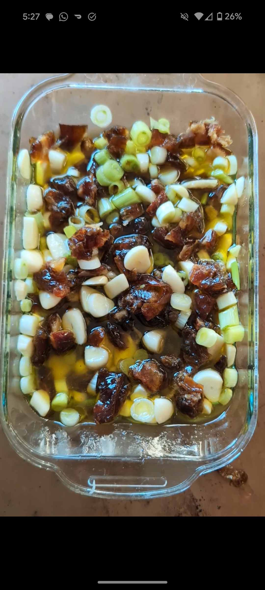 Image of Chop dates, garlic, scallions and place in small baking pan....