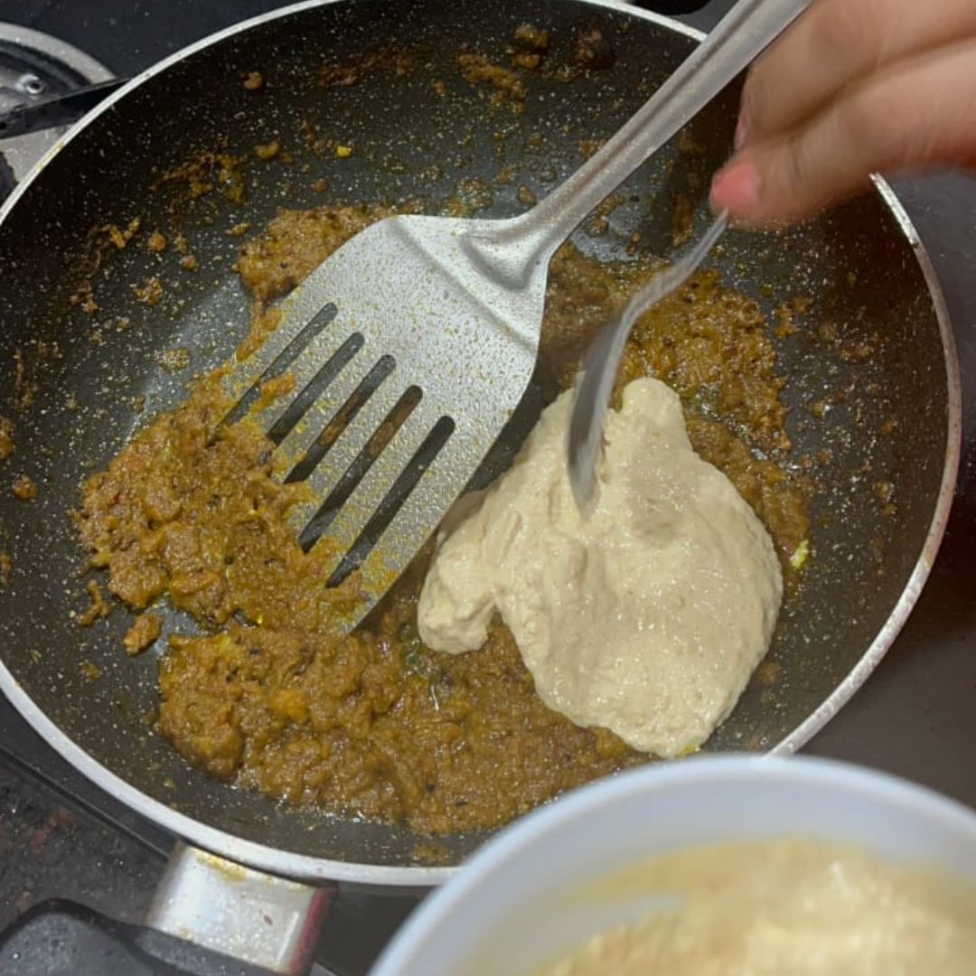 Image of Add the yellow mustard paste and mix thoroughly.