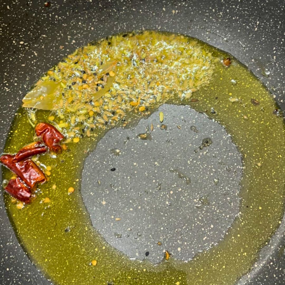 Image of Heat oil or ghee in a deep pan over medium...