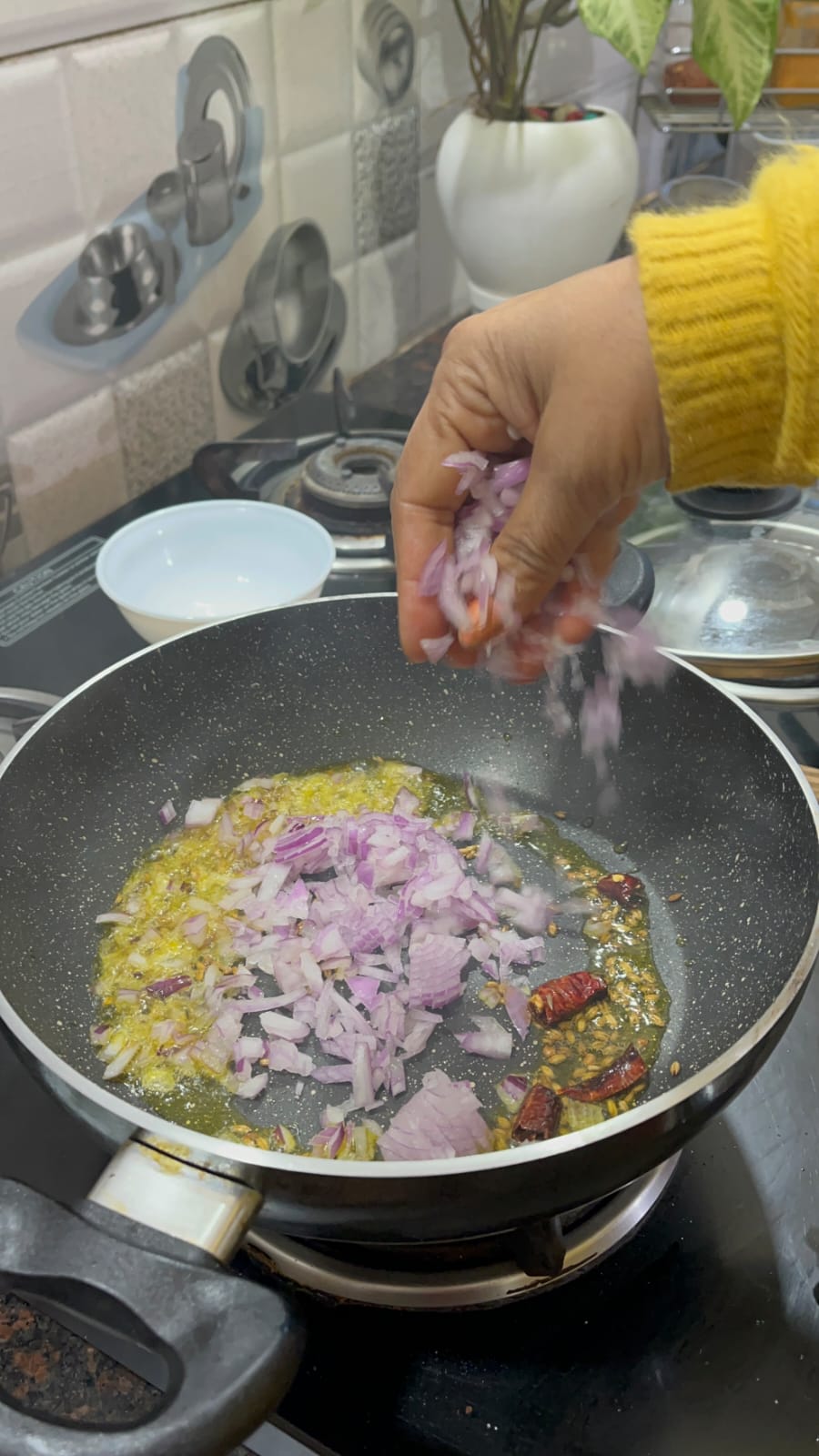 Image of Stir in the chopped onions and green chili. Sauté until...