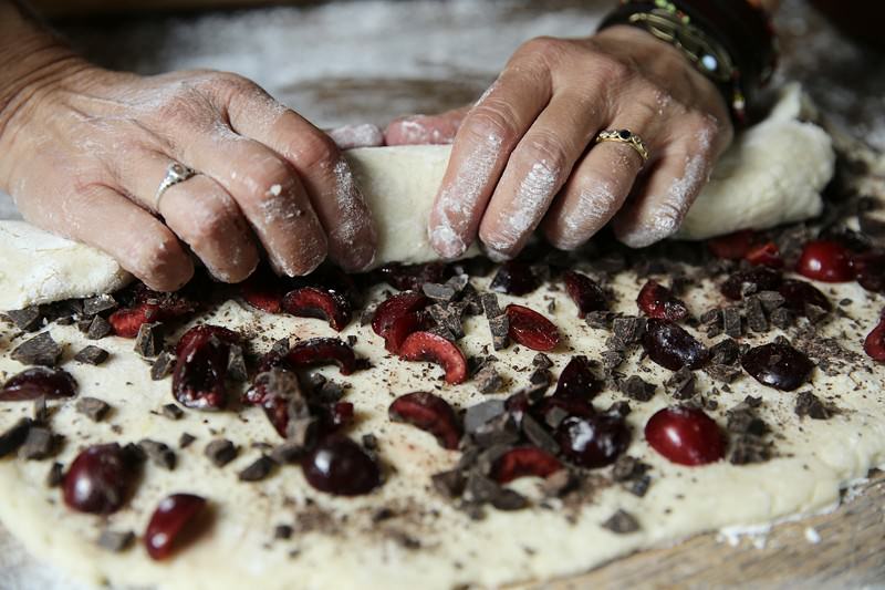 Image of Continue rolling the dough making sure all ingredients stay inside.