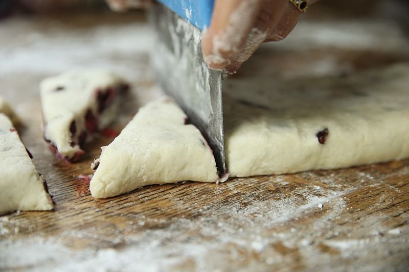 Image of Time has come to cut the dough into even triangles.