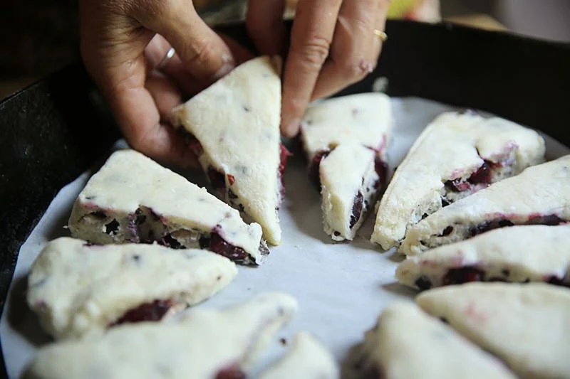 Image of Carefully transfer each triangle on the parchment paper inside the cast-iron...