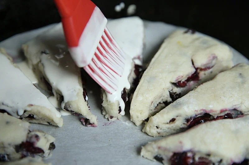 Image of Spread the cream over the scones with a brush.