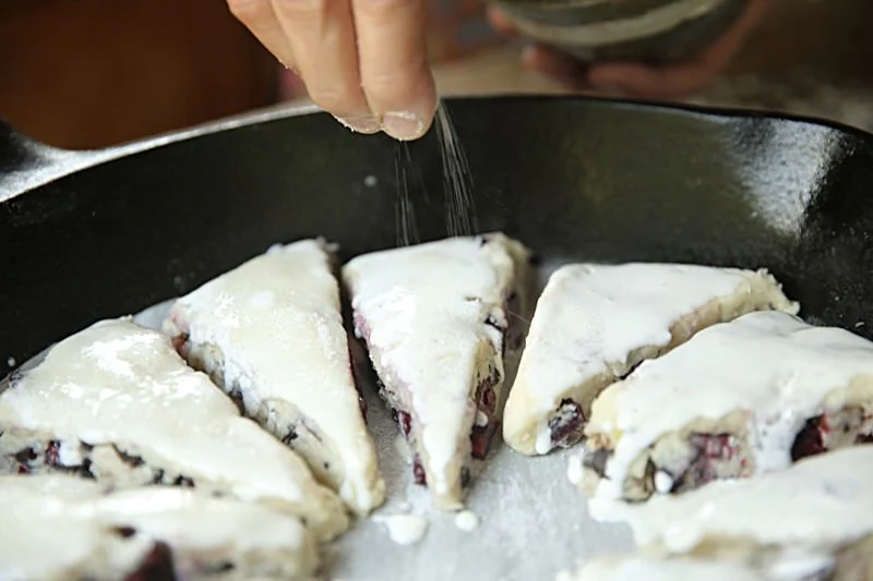 Image of Sprinkle sugar over the top of the scones.