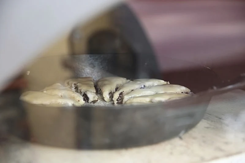 Image of Place the cast-iron skillet in the pre-heated wood-fired Gusto oven at 400°F.