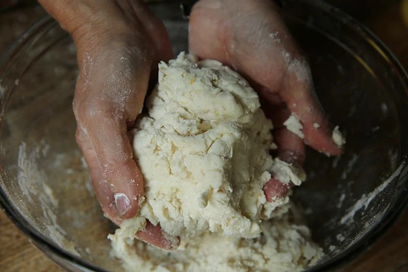 Image of When all ingredients are combined, cover the dough with plastic...