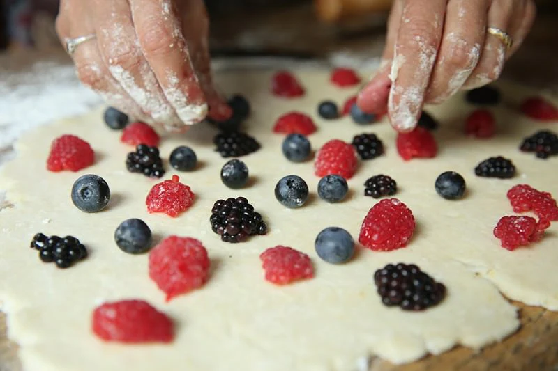 Image of Once the dough is rolled out, place the fruit evenly...