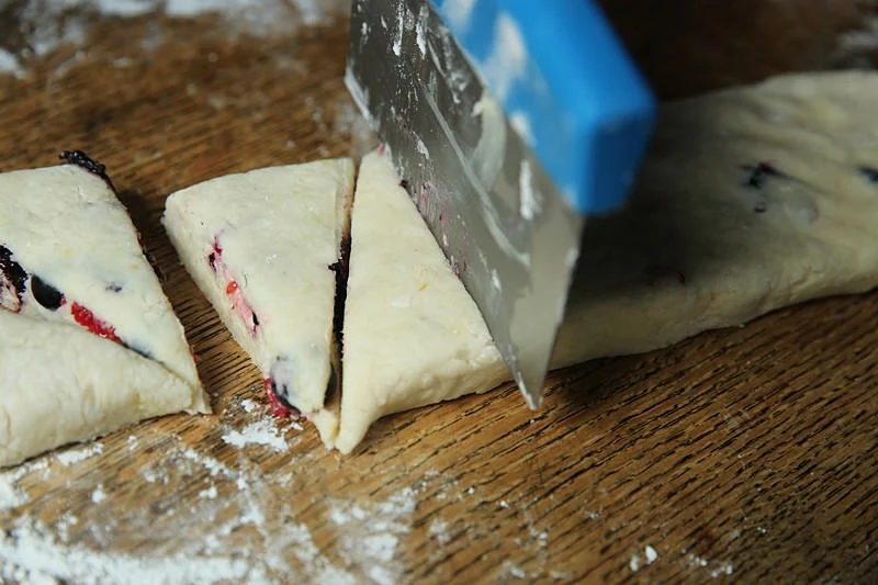 Image of Cut the dough into even triangles with the dough cutter.