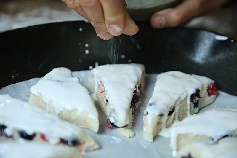 Image of Sprinkle sugar over the top of the scones.