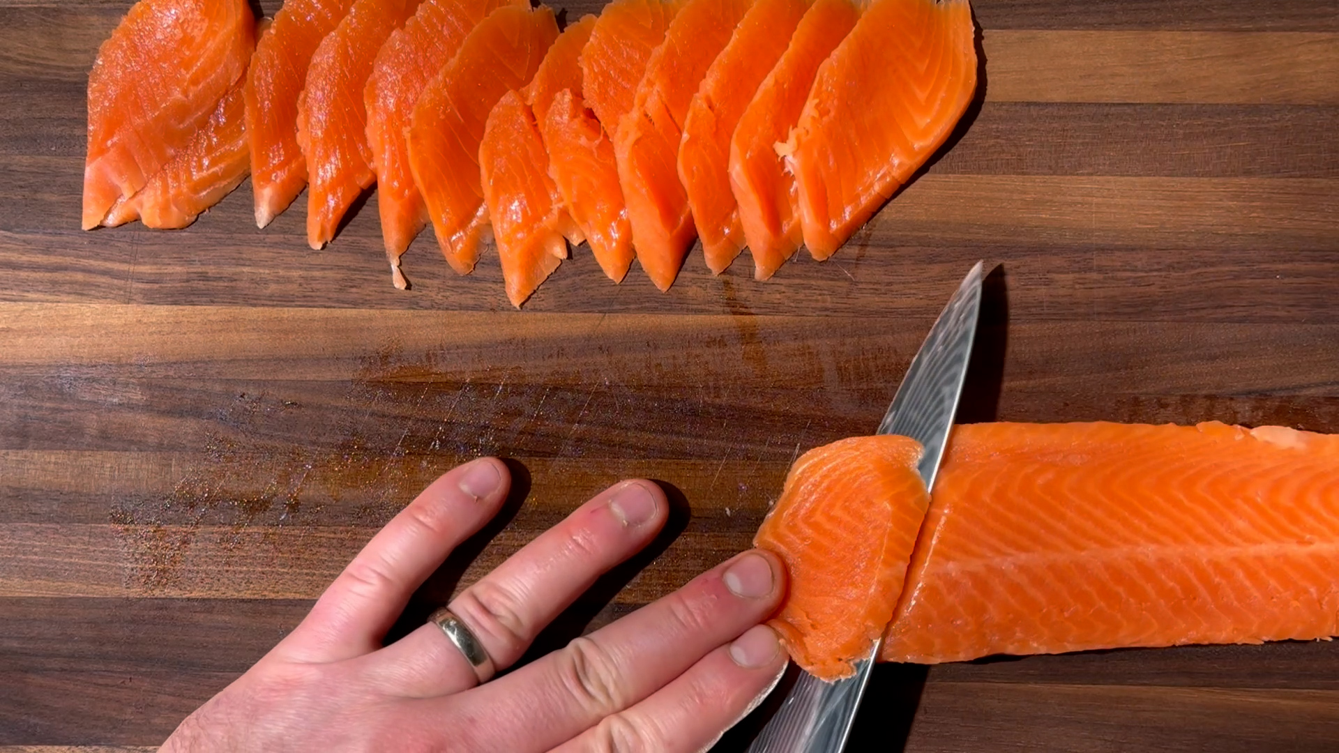 Image of Slice the Salmon: Using a sharp knife, sashimi slice the...