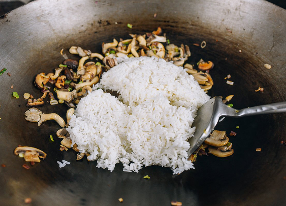 Image of Add the cooked rice to the skillet, breaking up any...