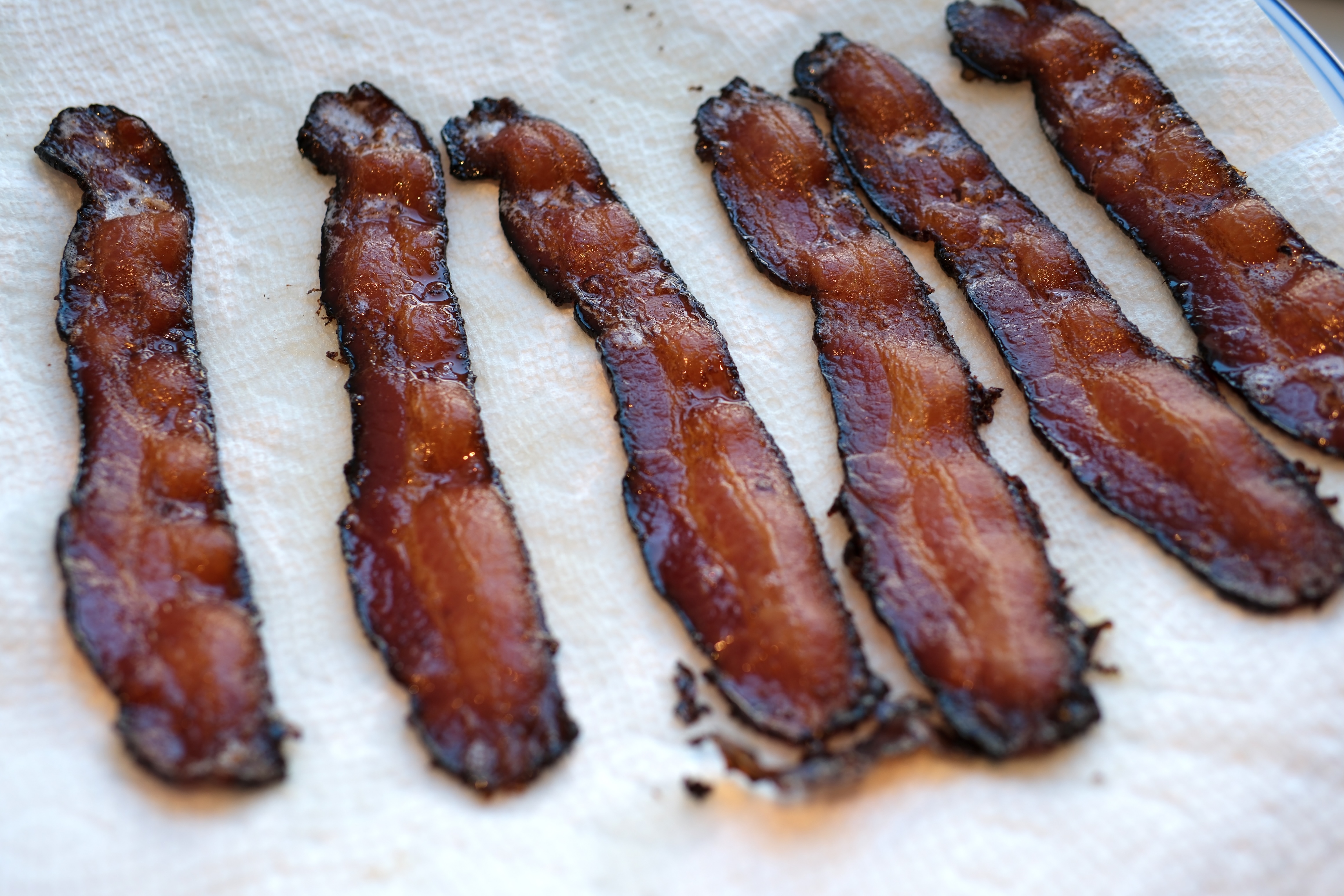 Image of Once done remove bacon onto a paper towel to cool...