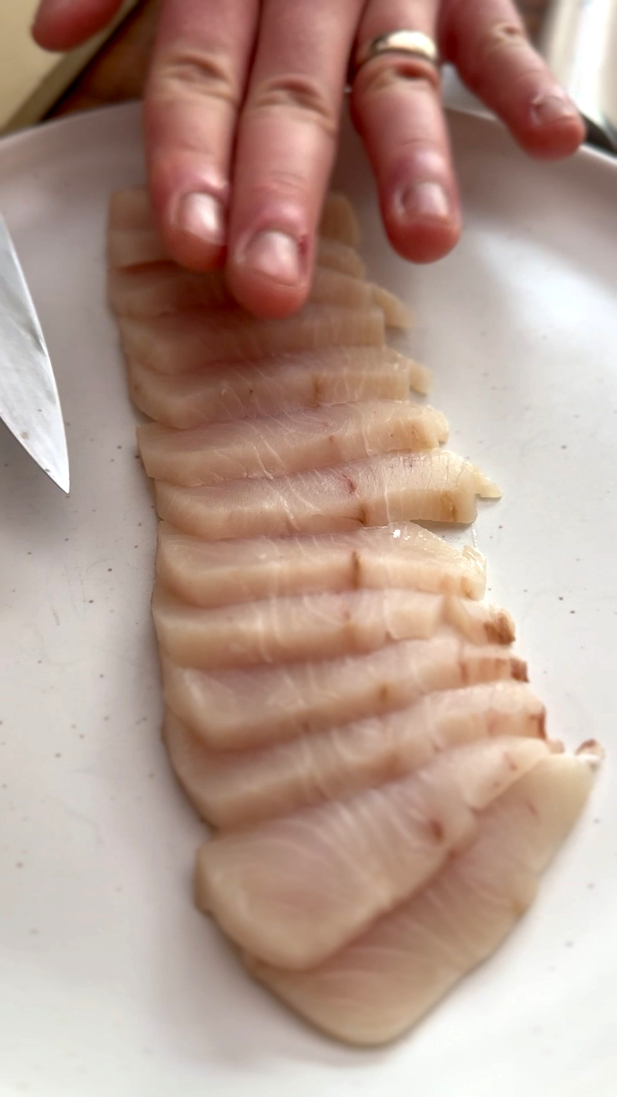 Image of Plate the Yellowtail: Fan the yellowtail slices across the center...