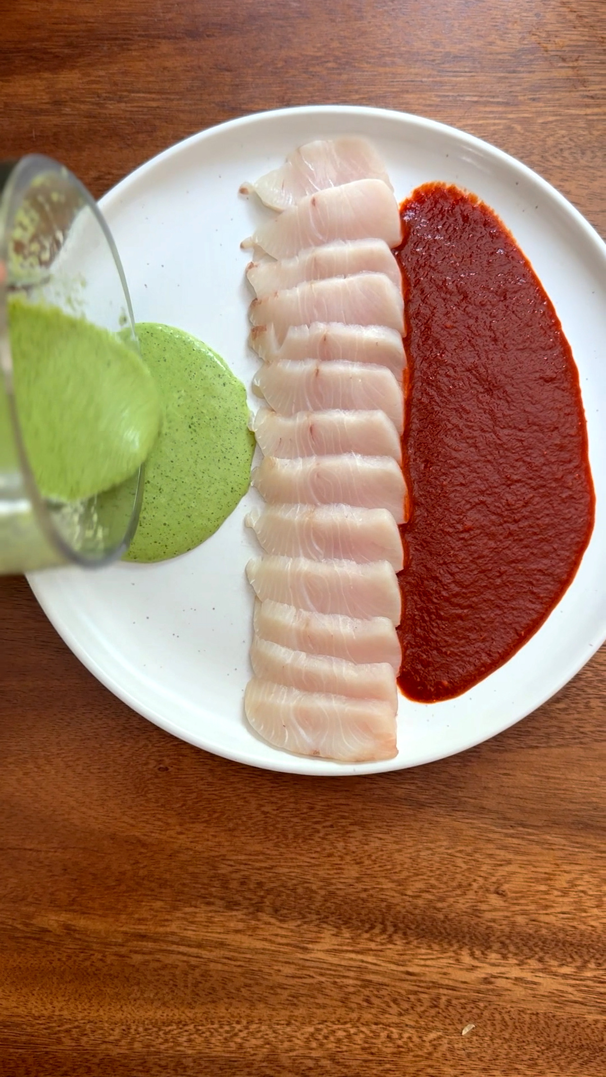 Image of Add the Sauces: Drizzle the ancho chile sauce on one...