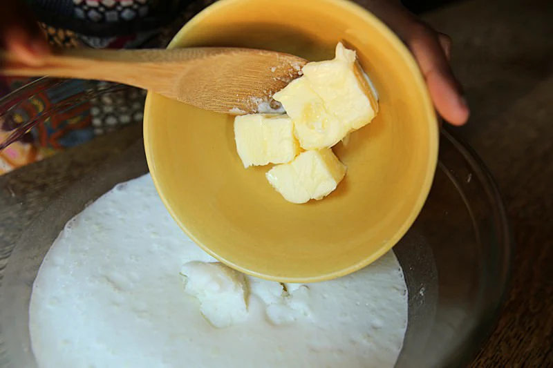 Image of Add two cups of water, whisking in the dry ingredients.