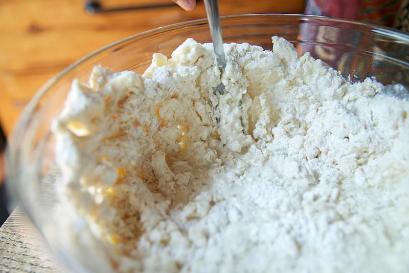 Image of Add 2 cups of flour, stir the ingredients with a...