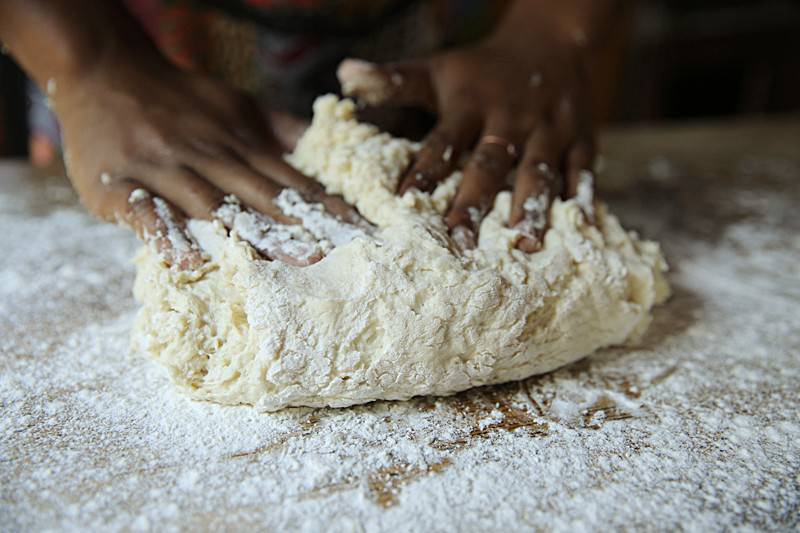 Image of Dust the top of the dough with additional flour.