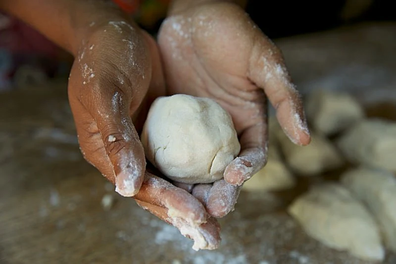 Image of Gently roll the dough into a ball with your hands.