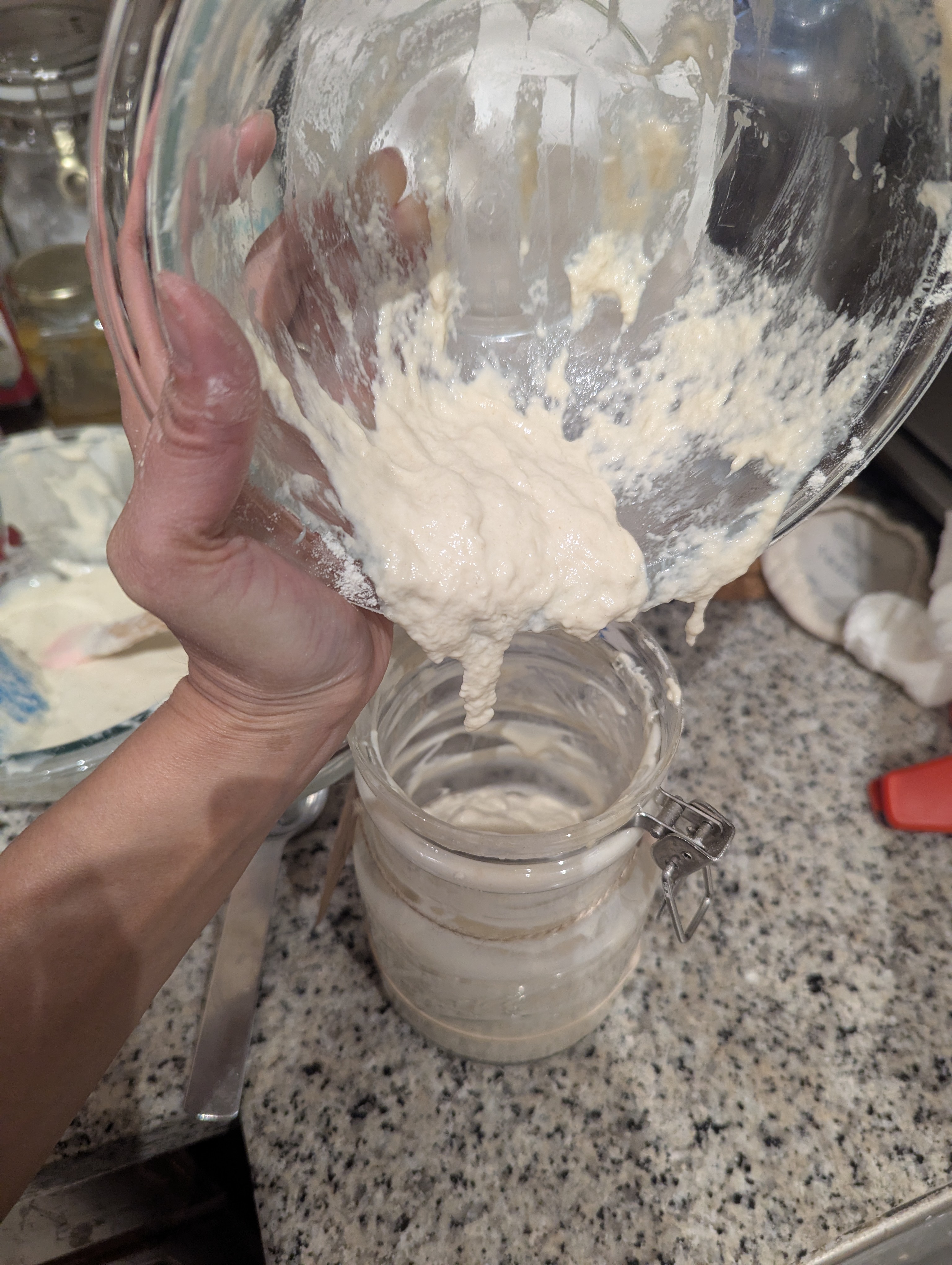 Image of Pour the starter mixture into a large mason jar, preferably...