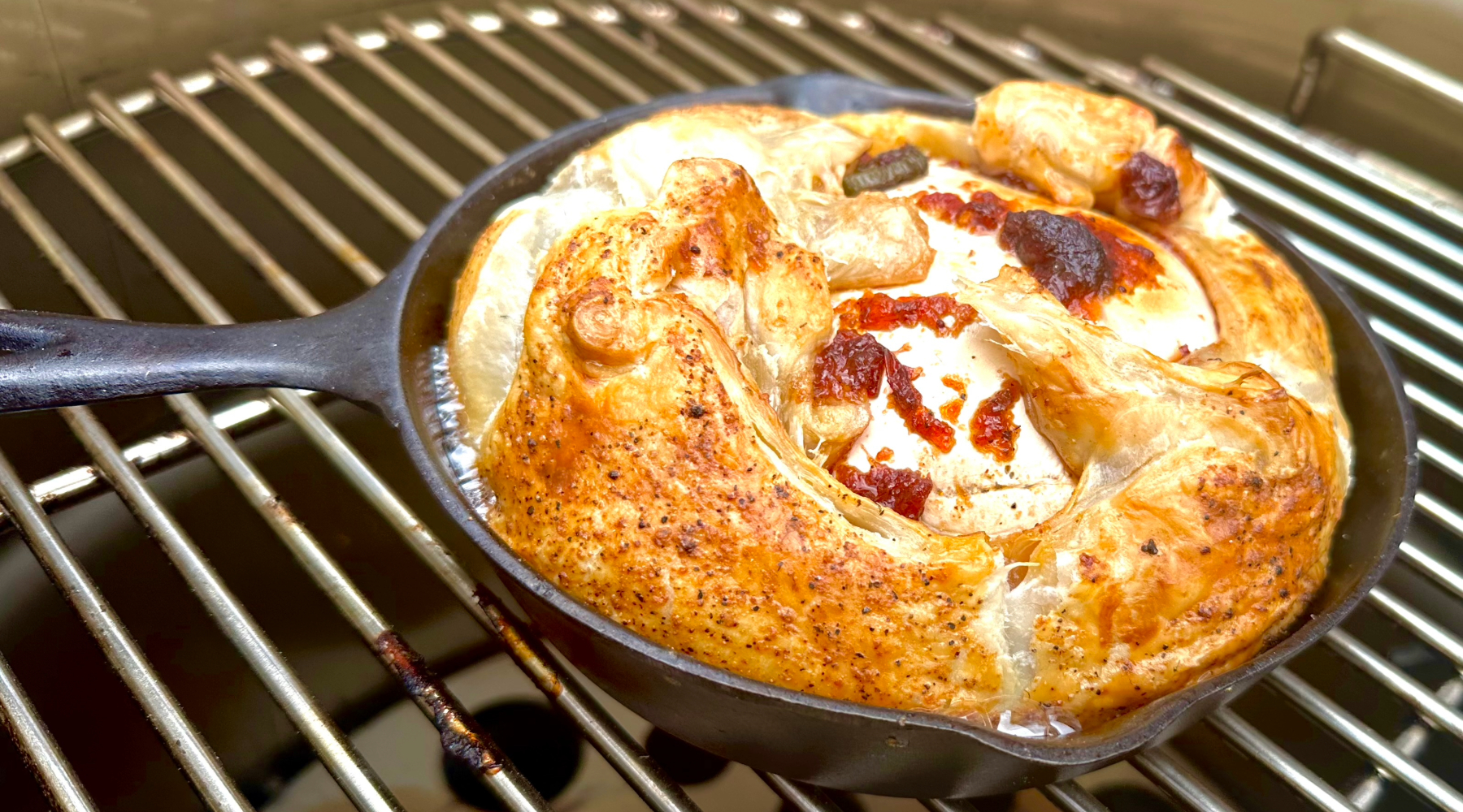 Image of Place the cast iron pan in the smoker and cook...