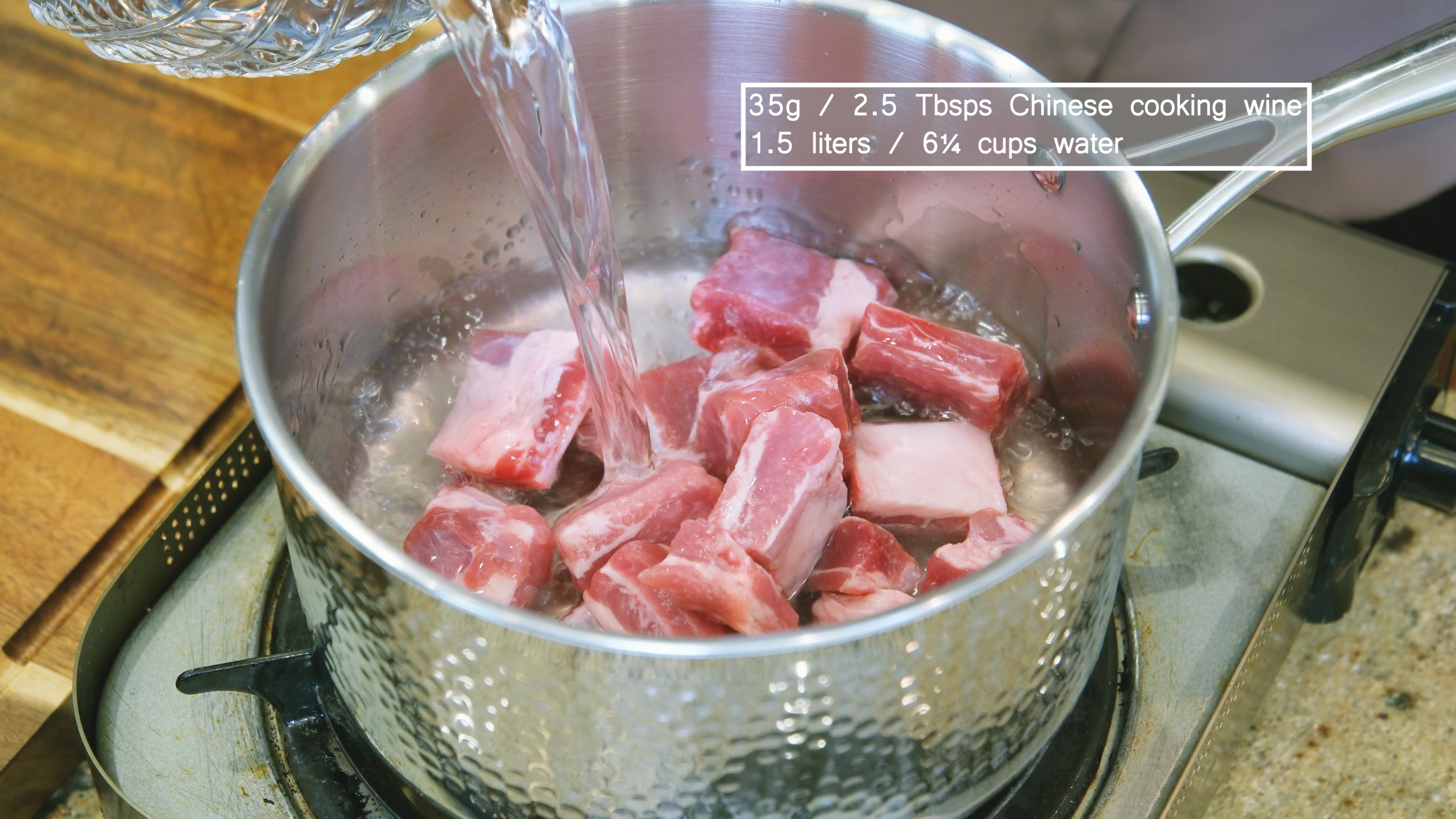 Image of Add the ribs, cooking wine, and 1.5 liters of water...