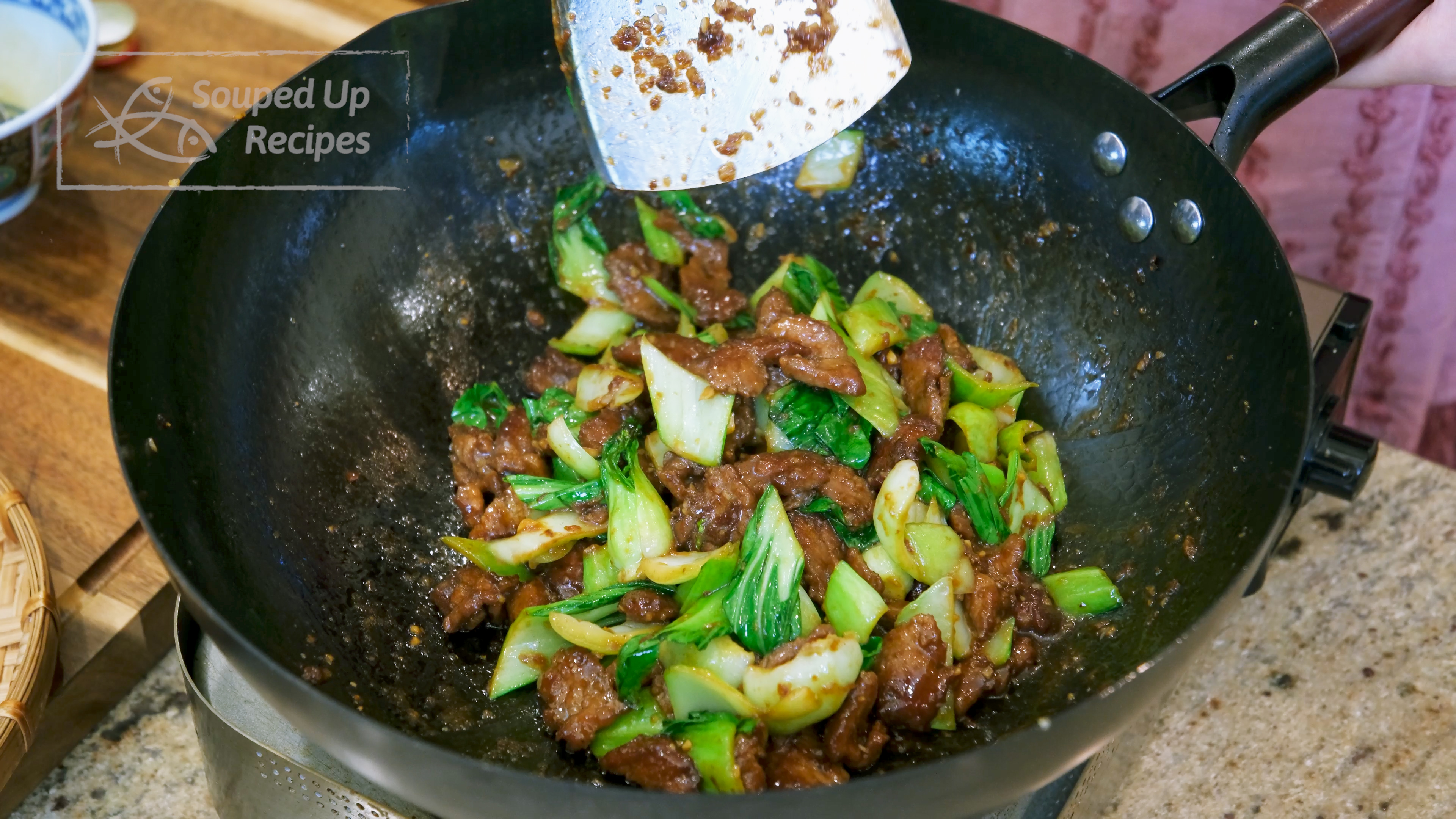 Image of Add the bok choy leaves and keep mixing until the...